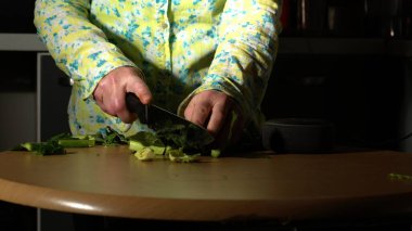 Woman prepares fresh healthy winter vegetables medium shot selective focus