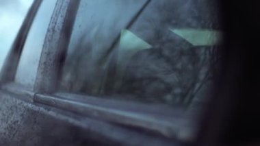 Car journey reflected on side of car window pov slow motion 4k selective focus