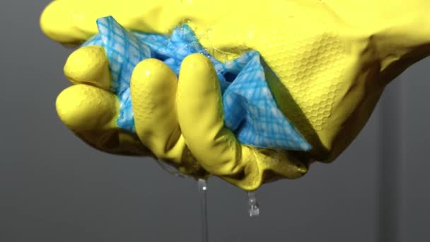 Hand Yellow Rubber Glove Squeezing Cleaning Cloth Close Slow Motion — Video Stock
