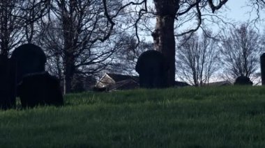 Gothic Church graveyard in English church wide dolly 4k shot selective focus 