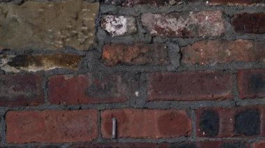 Old damaged grunge brick wall dolly close up selective focus 