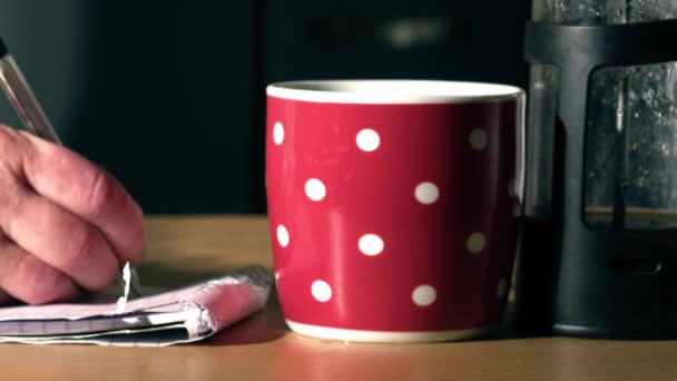 Woman Hot Drink Writing Notepad Kitchen Table Close Zoom Shot — Stockvideo