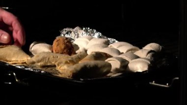 Baking party food in the oven medium slow motion 4k out shot selective focus