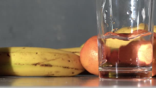 Pouring Glass Fresh Water Fresh Fruit Medium Shot Slow Motion — Vídeo de stock