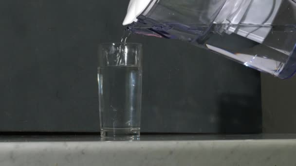 Woman Pouring Glass Water Water Filter Jug Medium Shot Slow — Stock videók