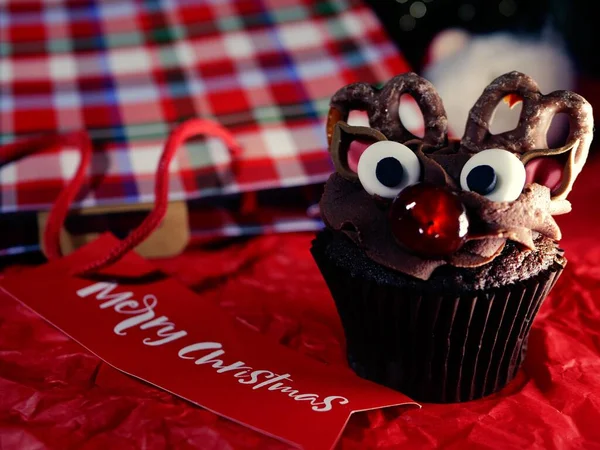 Christmas cupcake decorated with Christmas greeting close up shot selective focus