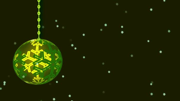Green Christmas Bauble Decoration Black Background Snowflakes Falling Animation — Stock Video