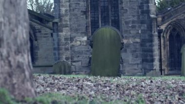 Old stone gothic church in England reveal shot 4k wide dolly selective focus