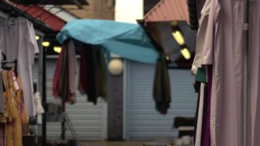 Market stall business woman at end of day wide 4k shot selective focus 