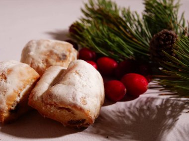 Christmas cake Stollen with cranberries close up selective focus