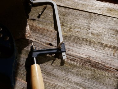 Rusty old saws in wooden background medium shot selective focus