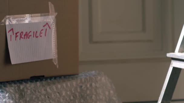 Moving Home Cardboard Boxes Medium Shot Zoom Slow Motion Shot — Stock Video