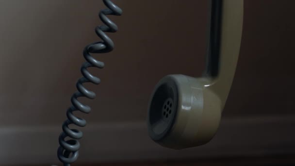 Vintage Rotary Phone Receiver Hanging Close Slow Motion Zoom Selective — Stock Video