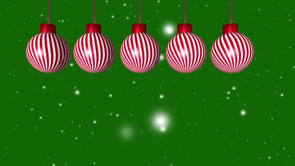 4Kアニメーションに落ちる雪片が緑色の背景に緑色のクリスマスバブル装飾 — ストック動画