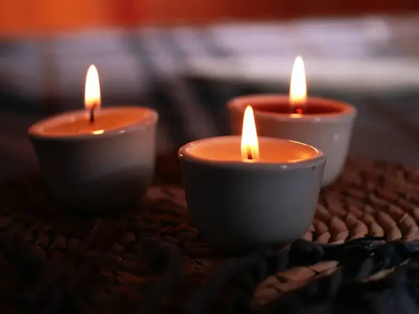 Tea light candles at dinner table close up shot selective focus
