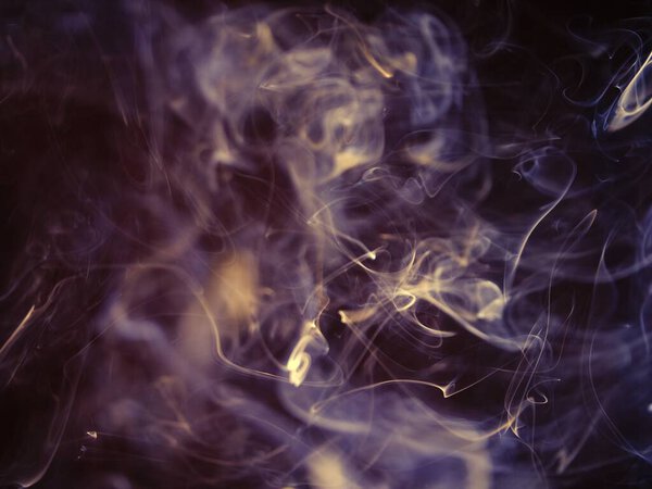 Smoke fumes on black background shot selective focus