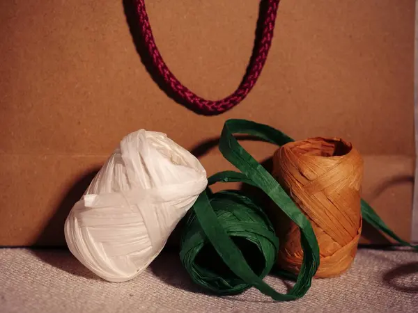 stock image Christmas gift bag and ribbons background close up shot selective focus 