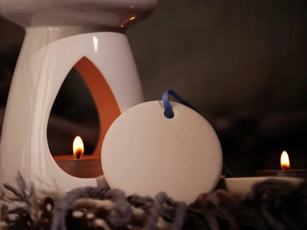 Essential oil burner with candles medium shot selective focus