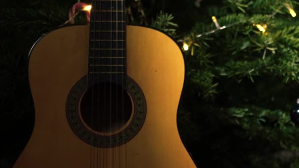 Accoustic Guitar Front Christmas Tree Medium Zoom Shot Selective Focus — Stock Video