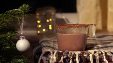 Hot Chocolate drink in Christmas festive scene medium zoom shot slow motion selective focus