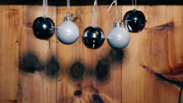 Silver Christmas Baubles Bells Rustic Wooden Background Medium Slow Motion — Stock Video