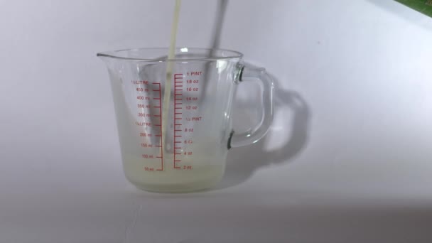 Jug Milk Glass Measuring Jug White Background Wide Shot Selective — Stock Video