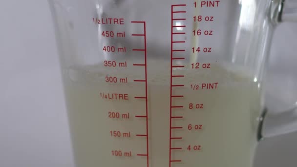 Jug Milk Glass Measuring Jug White Background Medium Zoom Shot — Stock Video