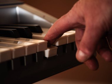 Muscian playing piano musical close up medium shot selective focus clipart