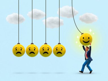 Newton 'un beşiğinde mutlu bir yüz küresi çeken minyatür bir adamın kavramsal görüntüsü üzgün yüzleri gülümsemeye dönüştürüyor. Hayattaki ve işteki olumlu düşünceyi, duygusal değişimi ve iyimserliği sembolize ediyor..