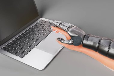 3d rendering of human hand with digital twin of artificial intelligence robot over touchpad of netbook on gray background
