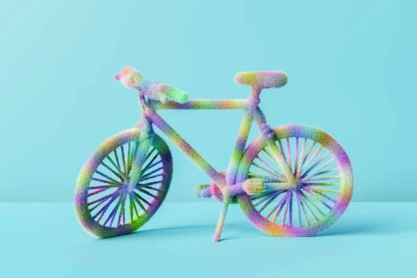 Візуалізація Барвистого Пухнастого Іграшкового Велосипеда Розміщеного Синьому Фоні Студії — стокове фото