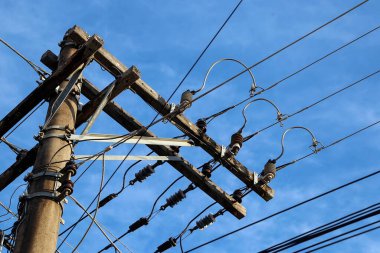 concrete pole with electrical power, telephony and fiber optic cabling - electricity concept