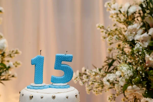 Blue party cake, 15th birthday, with blue number fifteen, white cake, 15 year old birthday cake