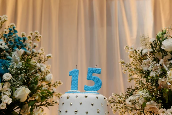 Blue party cake, 15th birthday, with blue number fifteen, white cake, 15 year old birthday cake