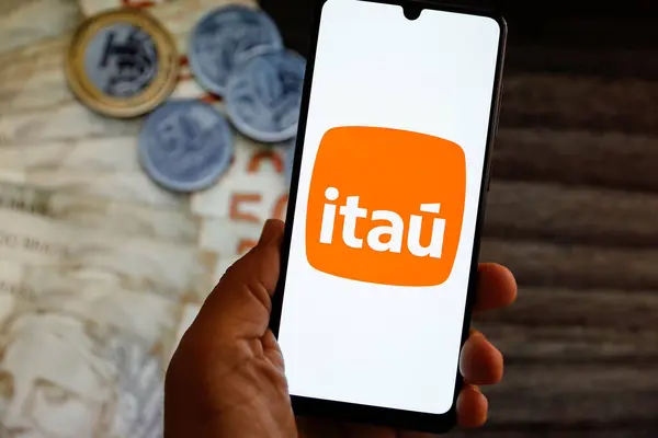 stock image Minas Gerais, Brazil - August 28, 2024: illustrative new image of Itau Unibanco bank company on the cell phone screen