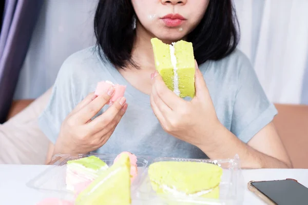 Asian woman lack of self-control over eating sweet desserts, sugar addiction, unhealthy habits concept