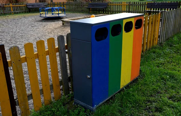 Sorting of waste already starts at the children\'s playground near the residential building. children acquire habits at an early age. color accentuation with pleasing colors of individual ingredients