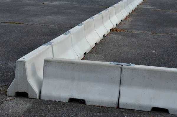 separation of lanes on the highway by means of heavy concrete barriers. they are used in places where driving directions are too close to each other. where it is not possible to use steel barriers