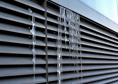 Ventilation grille along the house. basement windows are below ground level. Metal walking grid. foundation ventilation and drainage for removing moisture from masonry and bricks. pebbles, pebble, 