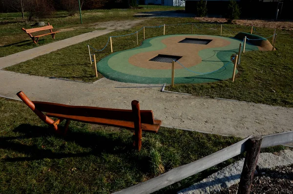 green rubber surfaces are soft and safe in all weathers. trampolines for children. irregular shape of different colors of amoebitis. walk through the park playground