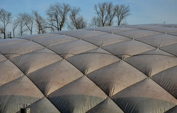 stock image inflatable playing arena, tennis head made of white rubber textile. in a regular grid it is reinforced with ropes. reminiscent of a pillow or quilted blanket. the compressors blow air inside. support 