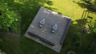 wooden oak prism bench in garden. for better drying of wood, grooves are milled lower part, which prevents tension and cracking of beam in park. side view, table tennis, fence rope, post, fir, abies