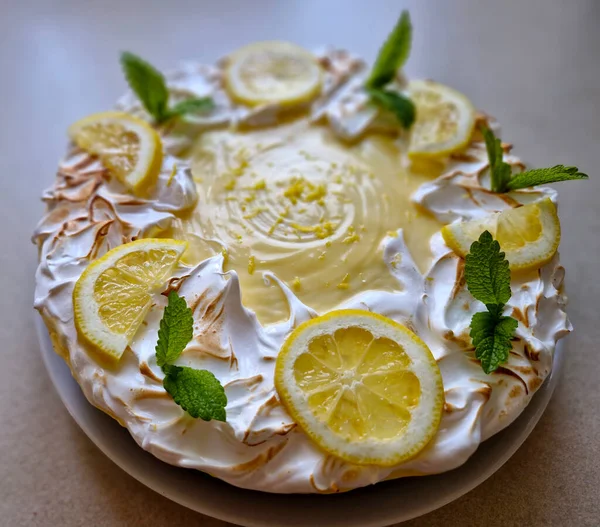 lemon meringue cake is layers of soft, moist lemon cake, filled with lemon curd and frosted with a luscious meringue frosting. Sweet and tangy all at once, its a showstopper