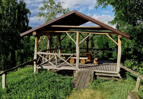 the observation terrace is a haven for game watchers in the reserve. a cozy pergola made of roughly processed beams from acacia branches. the railing is netted around the fence,