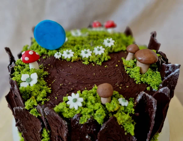 birthday cake with farm animals. hedgehog in the forest on a stump with mushrooms. a sign with the year and dedication. confectionery products to the order of the customer\'s wishes