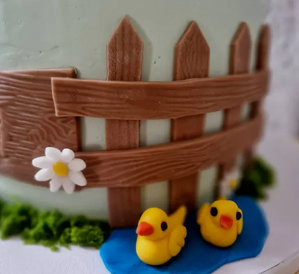 birthday cake with farm animals. hedgehog in the forest on a stump with mushrooms. a sign with the year and dedication. confectionery products to the order of the customer\'s wishes