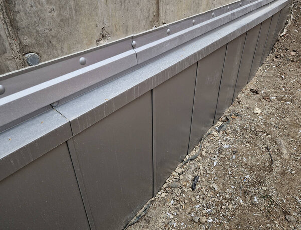 insulating film at the base of the wall protects against moisture. cup or stud insulation of the slope. sheeting also protects the mountains from a layer of blown snow, concrete, foundation, built