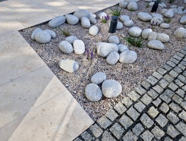ornamental flowerbed with perennials and stones made of gray granite, mulched pebbles in the city garden, prairie, ornamental grass, terrace by the pool mulching pebble, purple, white clipart