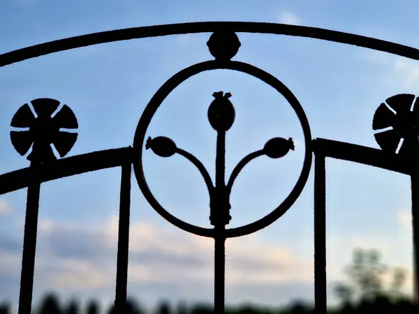 stock image beauty of blacksmithing in old rural cemeteries metal, brass and copper poppy flowers, balls, walled lattice lamps and inscriptions disappear under layers of rust