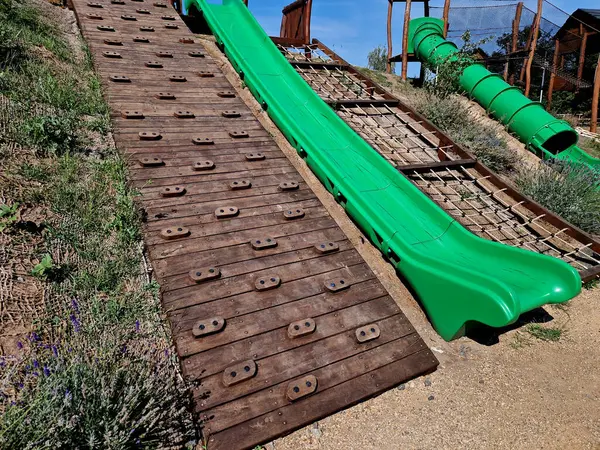 stock image climb the hill on the net and go down the slide made of fiberglass. climbing wall on an inclined plane, lavender, lavandula angustifolia